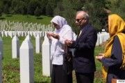 Ambassador Ahmed and Dr. Amineh Hoti w Khadijah Mehmedovic (praying at the graves of her husband and two sons)